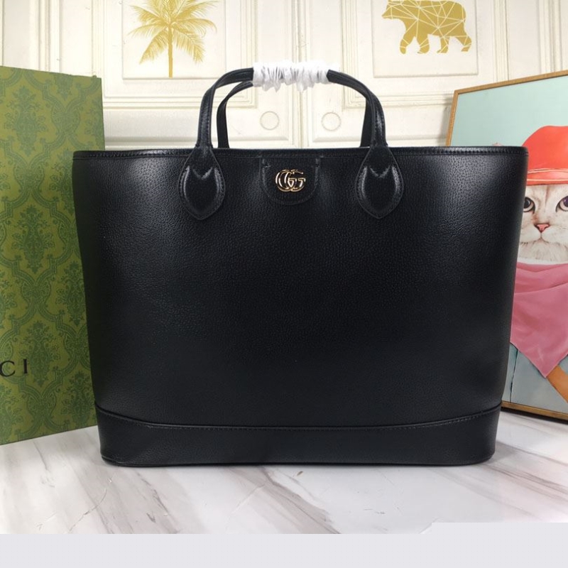 G*u*i shopping bags
